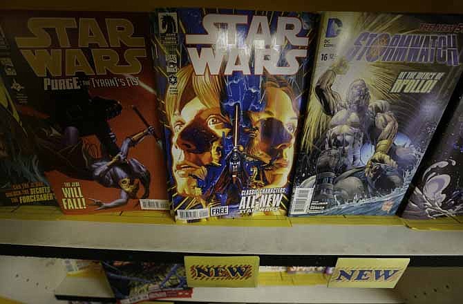 The new Star Wars comic is displayed at Fat Jack's Comicrypt, Wednesday, Jan. 9, 2013, in Philadelphia. Writer Brian Wood, artist Carlos D'Anda and Dark Horse Comics launch a new monthly series Wednesday that focuses on Luke Skywalker, Princess Leia, Han Solo and Chewbacca, as well as droids R2-D2 and C3P0, as they seek to establish a foothold for the rebellion in the aftermath of the Death Star's destruction. 