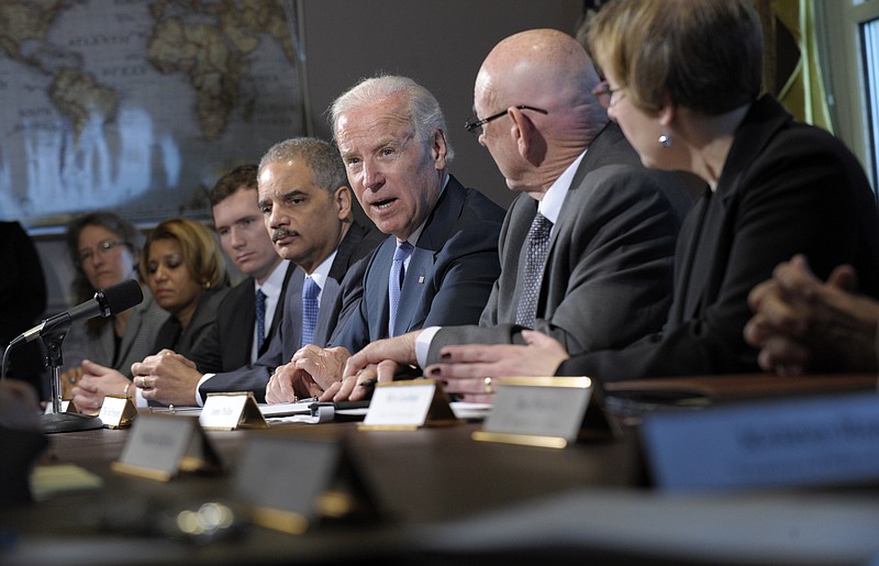 Vice President Joe Biden, with Attorney General Eric Holder at left, speaks Wednesday during a meeting with victims' groups and gun safety organizations in the Eisenhower Executive Office Building on the White House complex in Washington. Biden is holding a series of meetings this week as part of the effort he is leading to develop policy proposals in response to the Newtown, Conn., school shooting.