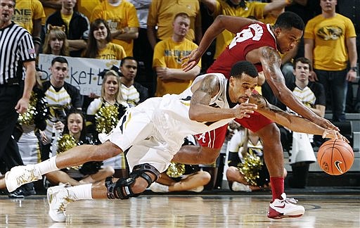 Missouri forward Laurence Bowers competes for a loose ball against Alabama guard Trevor Releford during the second half of their game Tuesday in Columbia. Bowers is out for today's game at Mississippi.