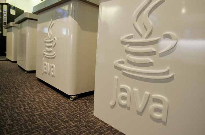 This April 23, 2007 file photo shows the Java logo at Sun Microsystems' offices in Menlo Park, Calif. The U.S. Department of Homeland Security is advising people to temporarily disable the Java software on their computers to avoid potential hacking attacks. Oracle Corp. bought Java as part of a $7.3 billion acquisition of the software's creator, Sun Microsystems, in 2010.
