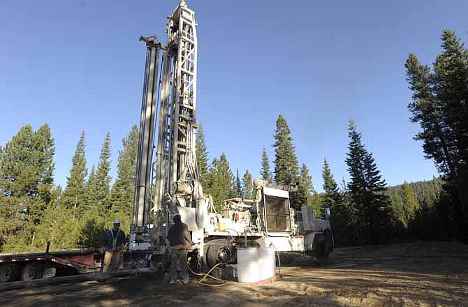 In this Oct. 15, 2010 file photo, Brandon Forseth, left, and Blaine Williams work on drilling a small test well at Newberry National Volcanic Monument near LaPine, Ore. Geothermal energy developers working on the flanks of an ancient Oregon volcano say they have taken an important technological step toward turning geothermal energy from a novelty into a major source of homegrown power that does not contribute to global warming.