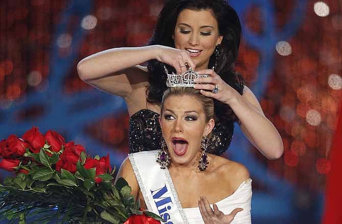 Miss New York Mallory Hagan is crowned Miss America 2013 by Miss America 2012 Laura Kaeppeler on Saturday, Jan. 12, 2013, in Las Vegas. 