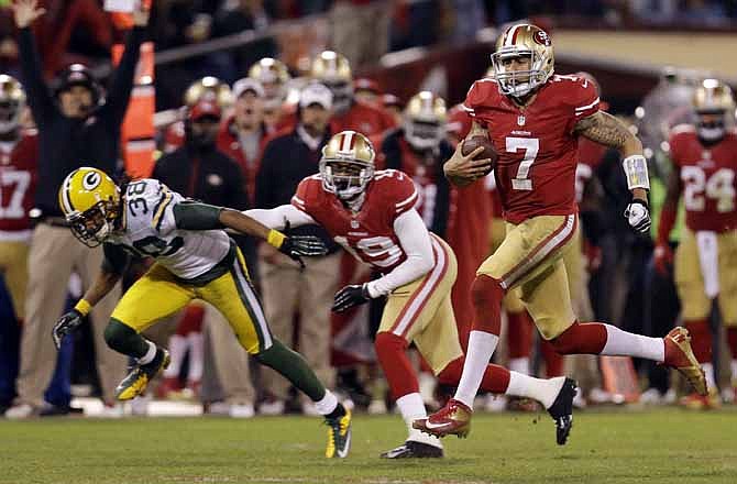 San Francisco 49ers quarterback Colin Kaepernick (7) runs for a 56-yard touchdown against the Green Bay Packers during the third quarter of an NFC divisional playoff NFL football game in San Francisco, Saturday, Jan. 12, 2013.
