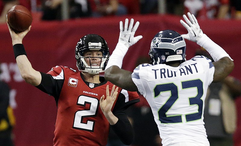 Atlanta Falcons quarterback Matt Ryan (2) throws against Seattle Seahawks cornerback Marcus Trufant (23) during the second half of an NFC divisional playoff NFL football game Sunday, Jan. 13, 2013, in Atlanta.