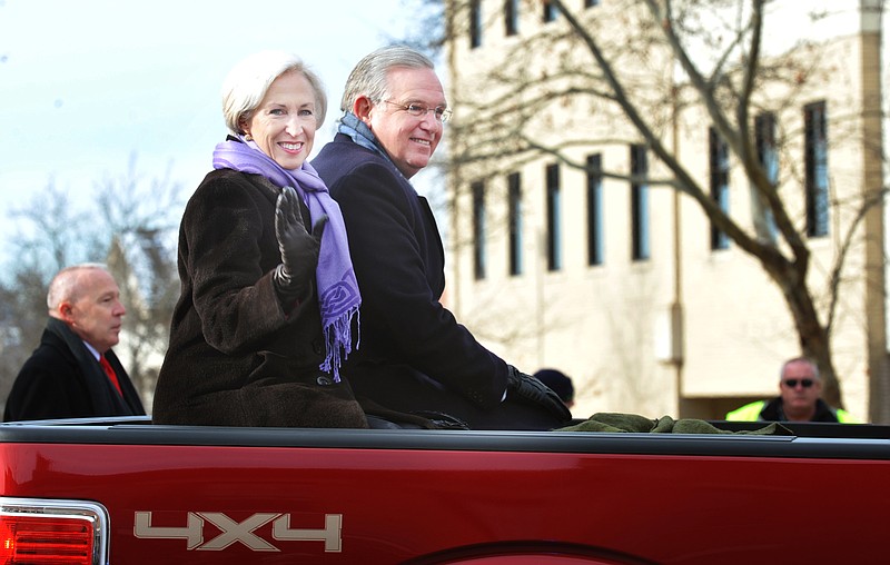 Gov. Jay Nixon and First Lady Georganne Nixon wave from their perch in a pickup truck bed during the governor's Inaugural Parade in Jefferson City on Monday morning, Jan. 14, 2013.