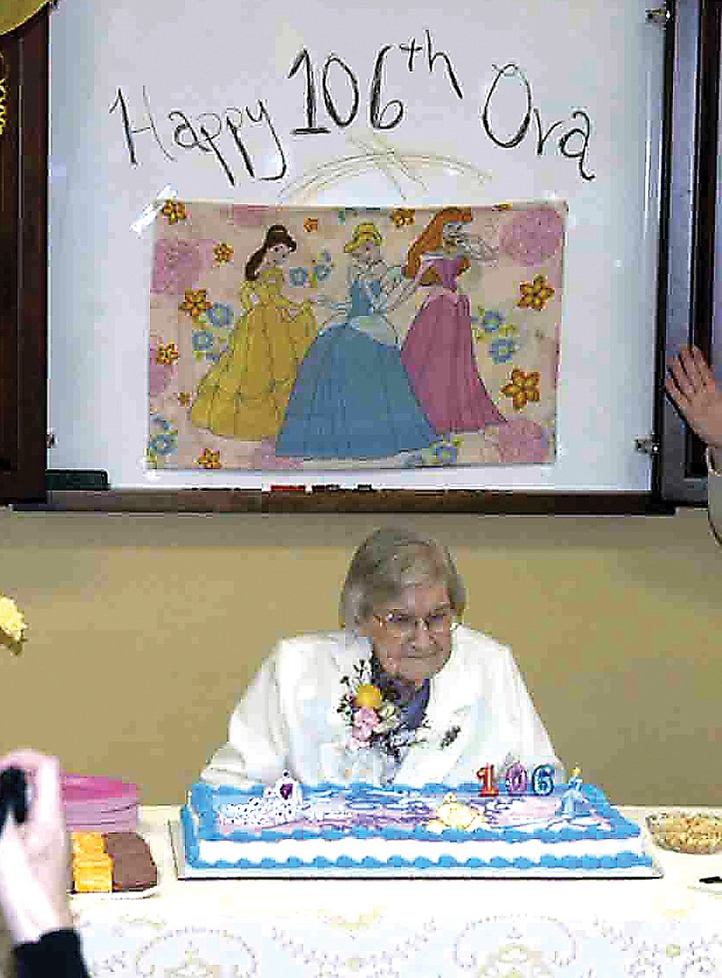Ova McCoy, age 106, with her birthday cake at Moniteau Care Center, California.