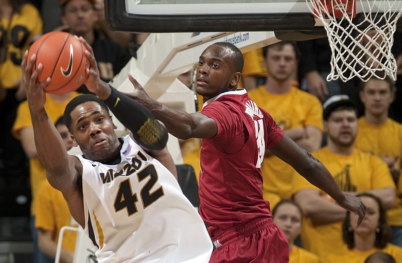Alex Oriakhi of Missouri pulls down a rebound past Devonta Pollard of Alabama during a game last week at Mizzou Arena. The Tigers are counting on Oriakhi to give more consistent efforts, starting with tonight's home game against Georgia.