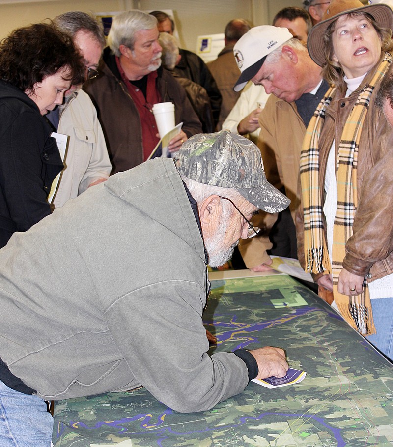 Callaway County residents living near a proposed new state road from U.S. 54 to the Callaway Energy Center check out a large map during a MoDOT open house and public comment event Tuesday afternoon at the Callaway County Library.