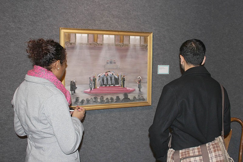 Westminster College seniors Tilla Batisaresare and Gaurav Khanal take in the first of a series of paintings by John Spencer Churchill of his uncle Winston Churchill's funeral procession. The paintings were donated to the museum by the Hall Foundation and are part of a new Hallmark Exhibit at the museum.
