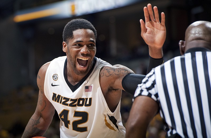 Alex Oriakhi of Missouri tries to get a high-five from an official during the second half of Wednesday night's game against Georgia at Mizzou Arena.