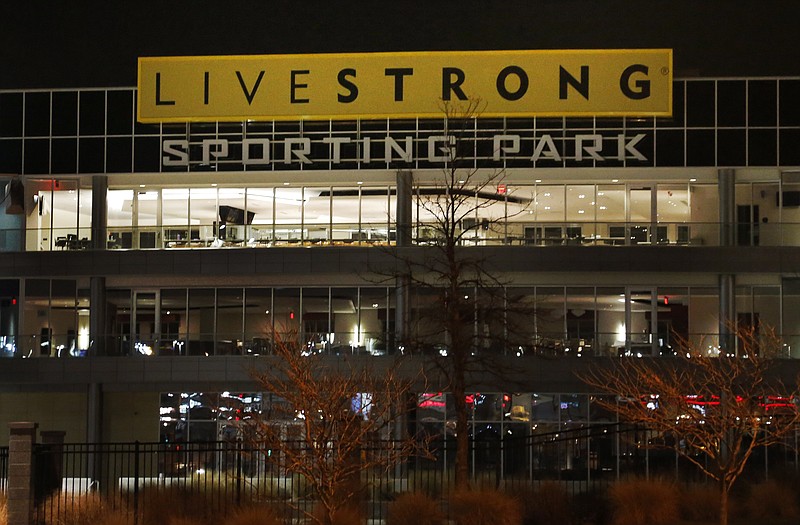 In this June 7, 2011, file photo, signs and balconies overlook the main entrance of Livestrong Sporting Park in Kansas City, Kan. Sporting K.C. has said it is cutting ties with Livestrong.