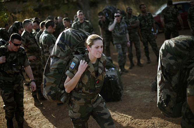 French troops arrive at Bamako's airport Thursday. Fighting raged in one Mali town, airstrikes hit another and army troops raced to protect a third, on the seventh day of the French-led military intervention to wrest back Mali's north from al Qaida-linked groups. 