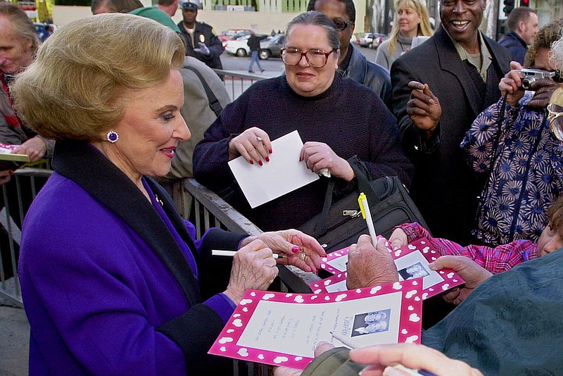 In this Feb. 14, 2001 file photo, "Dear Abby" advice columnist Pauline Friedman Phillips, 82, known to millions of readers as Abigail van Buren, signs autographs for some of dozens of fans after the dedication of a "Dear Abby" star on the Hollywood Walk of Fame in Los Angeles.  Phillips, who had Alzheimer's disease, died Wednesday, Jan. 16, 2013, she was 94.