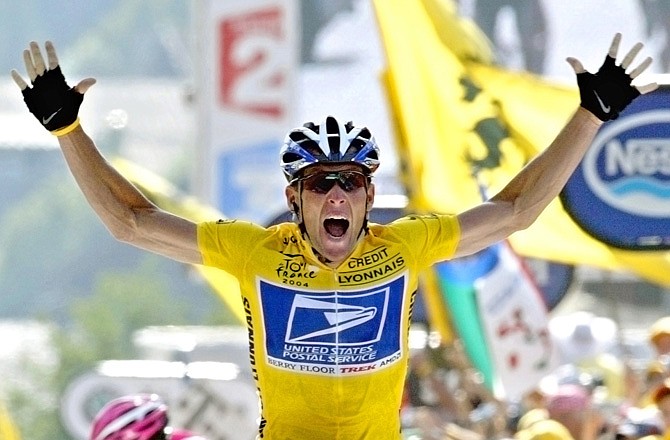 In this July 22, 2004, file photo, Lance Armstrong reacts as he crosses the finish line to win the 17th stage of the Tour de France. In 2004, Armstrong was also named Associated Press Male Athlete of the Year and ESPN's ESPY Award for Best Male Athlete.