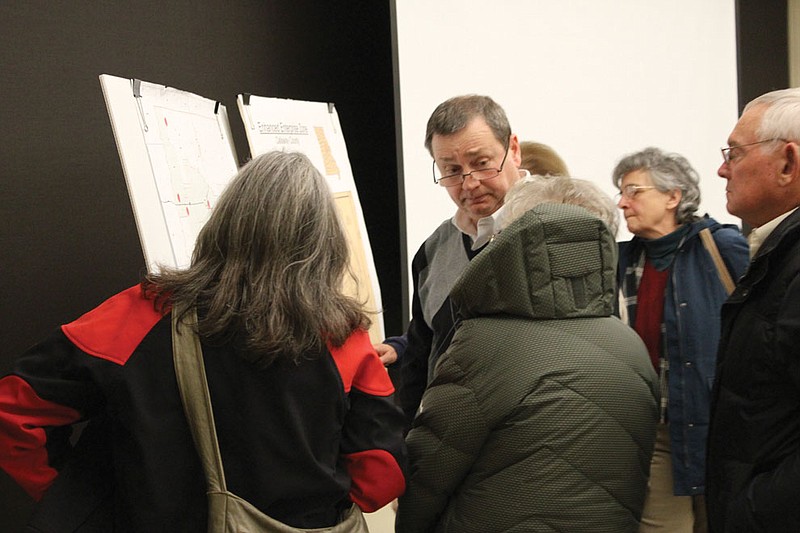 Bruce Hackmann of the Fulton Area Development Corporation explains data on a map of the proposed EEZs in Callaway County to a group of onlookers. Hackmann spoke and took questions at the Callaway Citizens for Fairtax meeting Thursday.