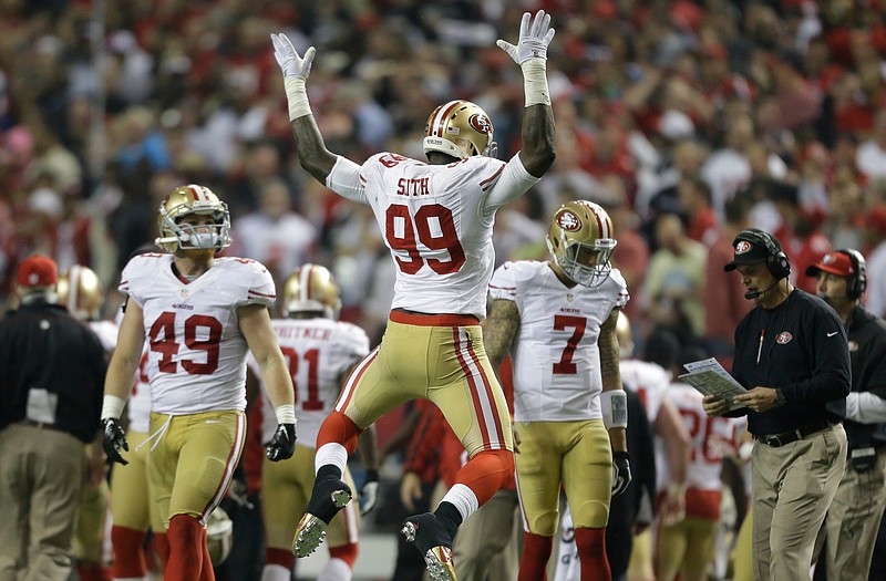 Aldon Smith of the 49ers celebrates after recovering a fumble during the second half of Sunday's NFC Championship game against the Falcons in Atlanta.