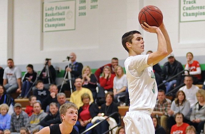 Logan Bax of Blair Oaks steps up and buries a 3-pointer after beating Southern Boone's Dylan Wright to the top of the key during Tuesday night's game in Wardsville.