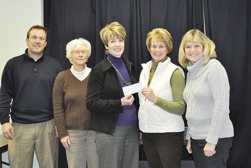 The Library Board in attendance were, from left to right, Tyler Davis, outgoing member Marion Gish, Connie walker, Laura Burger and Debbie Staton.