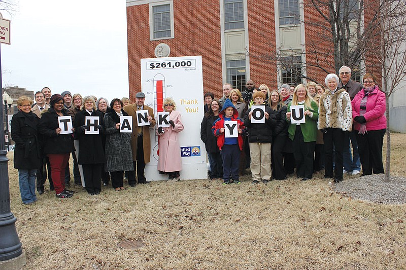Members of the Callaway County United Way's board of directors and representatives of the United Way's agencies give a display of thanks next to the completed goal chart Tuesday in front of the courthouse. UW Executive Director Kathy Richey Liddle, far left, said that this was the quickest they have ever reached their Fall Campaign goal.