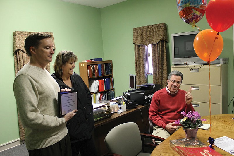 CMCA Executive Director Darin Preis presents a plaque declaring SERVE, Inc. the CMCA's Community Partner of the Year to a surprised SERVE Executive Director Steve Mallinckrodt Wednesday. SERVE was nominated for the annual award, given to just one agency in CMCA's eight-county jurisdiction, for their dedication to helping those in need in Callaway.