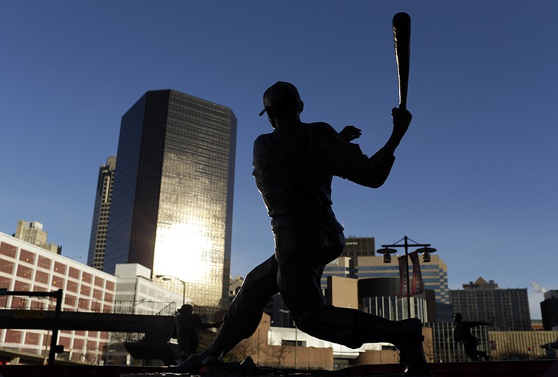 A statue of former St. Louis Cardinals baseball player Stan Musial stands outside Busch Stadium. Musial, one of baseball's greatest hitters and a Hall of Famer with the Cardinals for more than two decades, died Saturday. Lawmakers are now trying to get the new bridge  to carry Interstate 70 traffic named after the former Cardinal. 