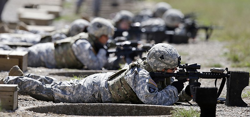 Female soldiers from 1st Brigade Combat Team, 101st Airborne Division train on a firing range while testing new body armor in Sept. 2012 at Fort Campbell, Ky., in preparation for deployment to Afghanistan. 