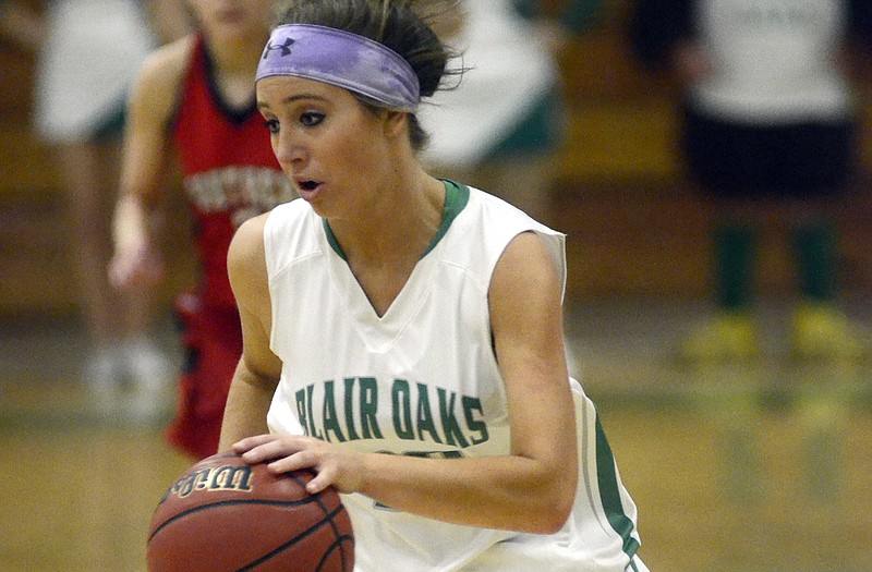Blair Oaks' LeeAnn Polowy drives the ball upcourt during the final seconds of the first half of Thursday's game with Southern Boone in Wardsville.