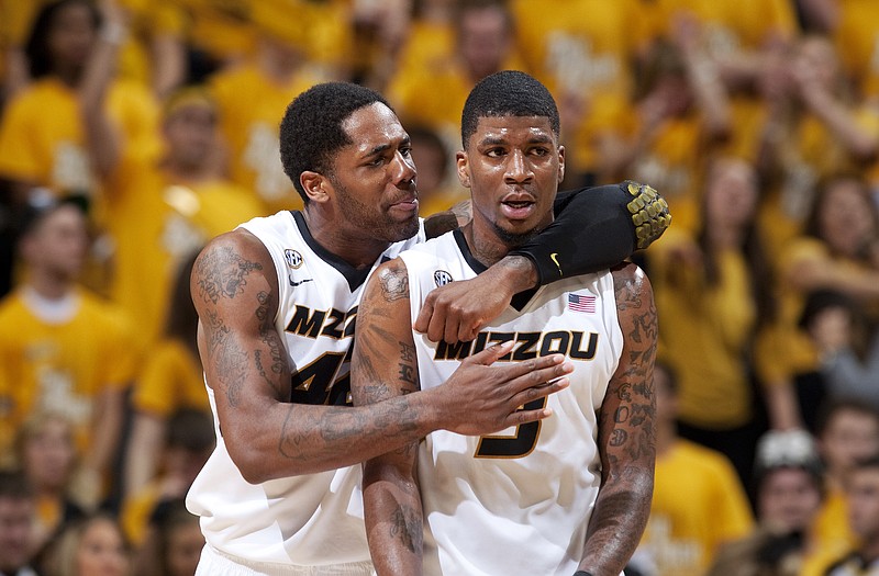 Alex Oriakhi (left) grabs Missouri teammate Tony Criswell during the first half of Saturday's game against Vanderbilt at Mizzou Arena.