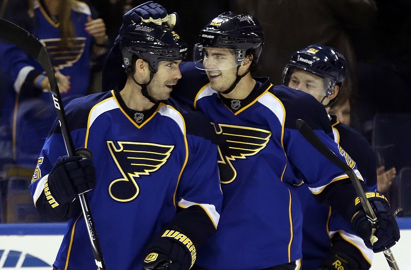 Barret Jackman (left) is congratulated by Blues teammate Kevin Shattenkirk after scoring during the third period of Sunday night's game against the Wild in St. Louis.
