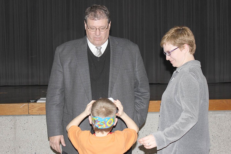 South Callaway High School science teacher Carrie McDonald and her son, kindergartener Owen Busalacki greet new superintendent Kevin Hillman at an introductory meeting Monday afternoon. Hillman will take over for retiring superintendent Mary Lynn Battles at the end of June.