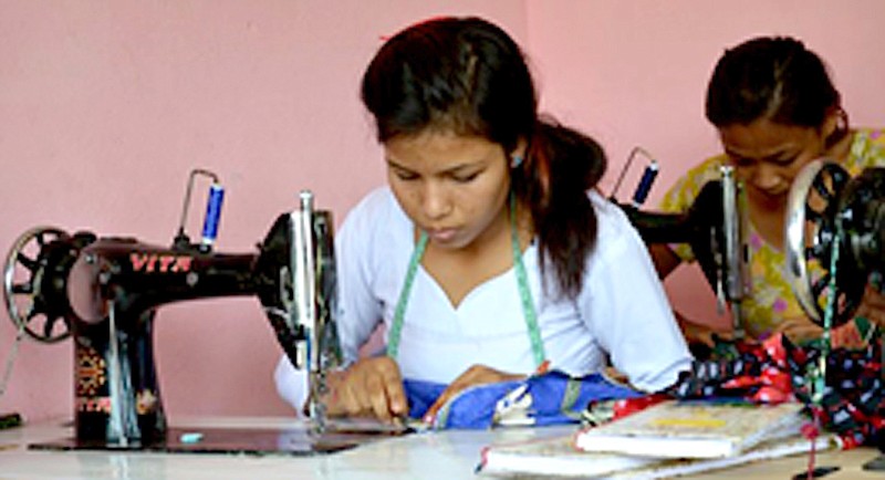 A Nepalese woman rescued from sex trafficking sews fashions for Elegantees, a clothing line which offers employment to trafficking victims. William Woods University's International Justice Mission will be hosting an Elegantees fashion show on Feb. 4.