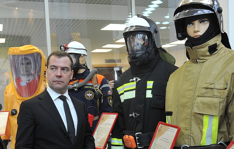 Russian Prime Minister Dmitry Medvedev, front left, visits an exhibition of rescue equipment in Krasnogorsk, Wednesday, outside Moscow.