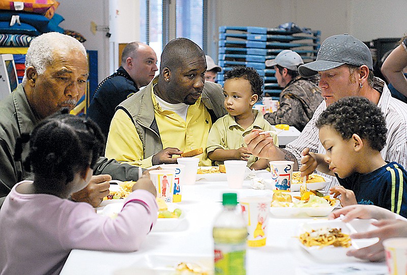 Clockwise from left: LaCheyla Curry, Jack McBride, Louie Owens, Noah Owens, Logan Patton and Elijah Owens eat lunch together during the 2007 100 Man Luncheon. The annual event that encourages community members and family to spend time with children at Callaway County Head Start is set to return.