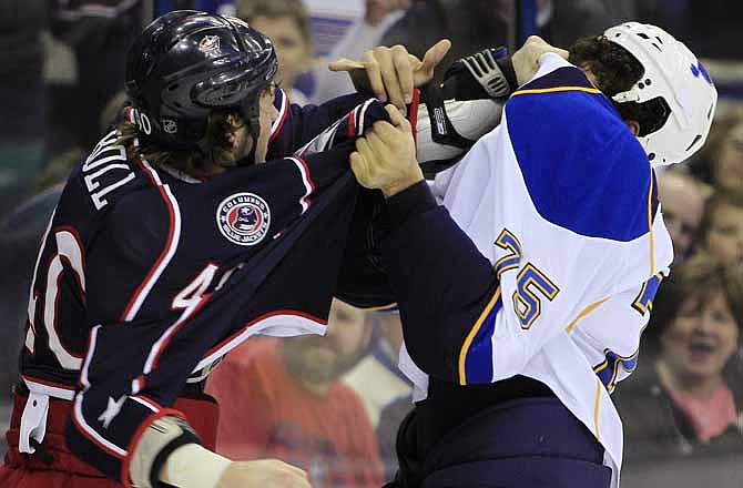 St. Louis Blues' Ryan Reaves, right, and Columbus Blue Jackets' Jared Boll fight during the second period of an NHL hockey game Thursday, Jan. 31, 2013, in Columbus, Ohio.
