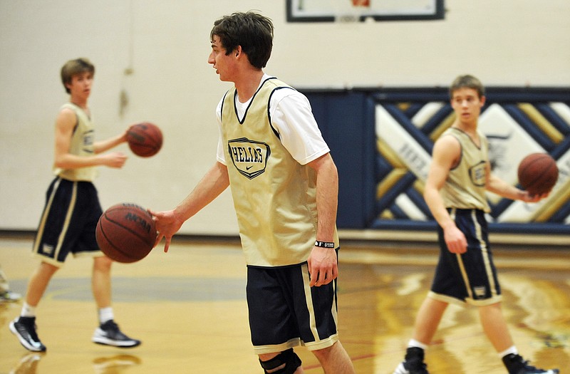 Helias senior Dylan Gish practices with teammates as he prepares to make his 2012-13 debut Friday night.