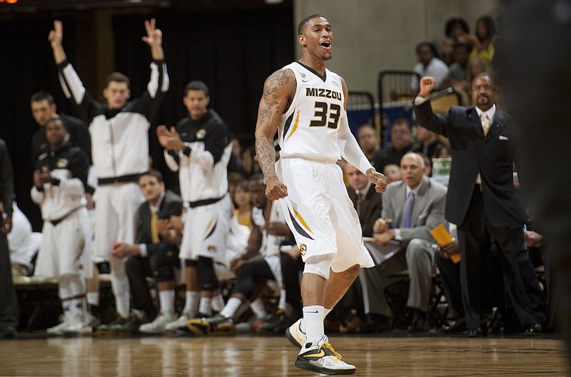 Missouri's Earnest Ross (33) celebrates in front of the Missouri bench after making a three-point shot during the first half of an NCAA college basketball game against Auburn Saturday, Feb. 2, 2013, in Columbia, Mo. Ross is a transfer from Auburn.