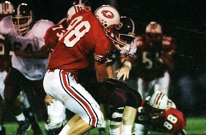 Justin Smith makes a tackle against Poplar Bluff in a home game on Oct. 3, 1997. Smith played for Missouri after graduating from Jefferson City High School.