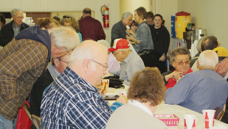 Callaway County residents gathered at the Auxvasse Community Hall for a pulled pork lunch during the 2012 Loafer's Week. This year's event, which supports the Community Hall and many other organizations in the area, is scheduled to run Feb. 18-23.