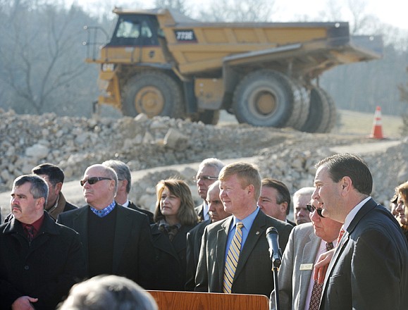 Sen. Mike Kehoe, R-Jefferson City, and Rudy Farber, second from right at microphone, spoke at a news conference advocating a proposed constitutional amendment to add a penny in sales taxes for highway maintenance.