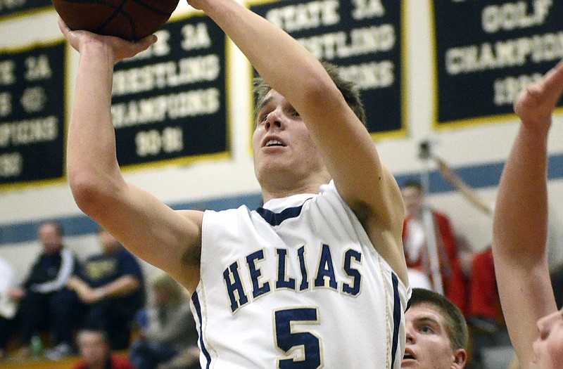 Brock Gerstner of Helias drives the baseline for a layup during Tuesday night's game against Mexico at Rackers Fieldhouse.