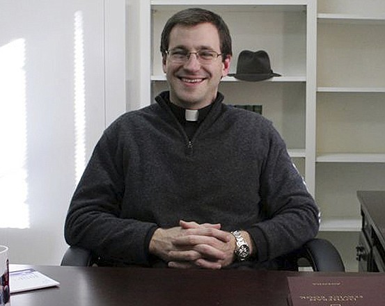 The Rev. Rob Morris sits in his office at Christ the King Lutheran Church in Newtown, Conn. The Lutheran Church-Missouri Synod denomination is reprimanding Rev. Morris for participating in an interfaith vigil after the Sandy Hook massacre. 