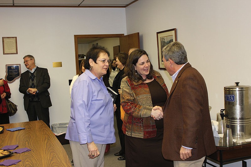 Flanked by Gracia Backer, State Senator Jolie Justus, center, meets with county officials and other new constituents at a meet and greet Thursday at the Kingdom of Callaway Chamber of Commerce. Due to redistricting, the Kansas City senator will represent Callaway and five other mid-Missouri counties  for the next two years.