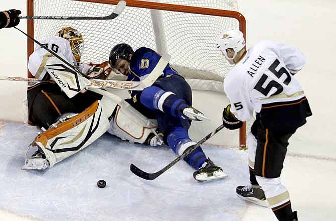 St. Louis Blues' Alexander Steen, center, collides with Anaheim Ducks goalie Viktor Fasth, left, of Sweden, as Ducks' Bryan Allen, right, clears the puck during the third period of an NHL hockey game, Saturday, Feb. 9, 2013, in St. Louis. The Ducks won 6-5 in a shootout.