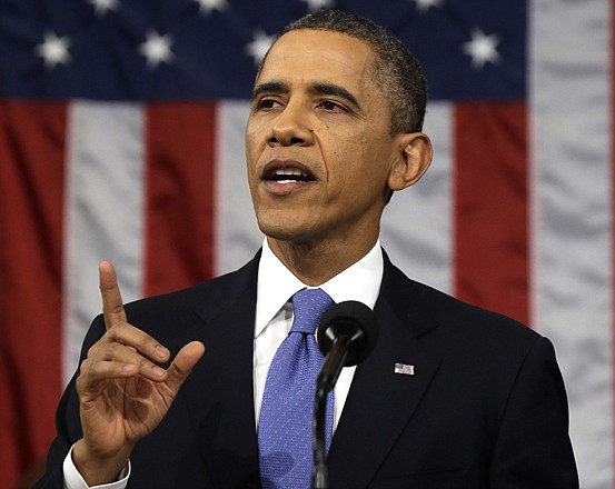 President Barack Obama gestures as he gives his State of the Union address Tuesday evening.