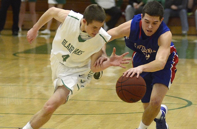 Brett Voss of Blair Oaks and Cole George of California battle to gain control of the ball during the second quarter of Tuesday night's game in Wardsville.