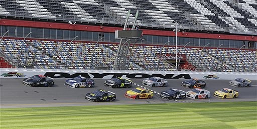 A pack of cars drives past the start/finish line during a test session last month at Daytona International Speedway in Daytona Beach, Fla. NASCAR's Gen-6 race car makes its long-awaited debut and the success of the 2013 season could depend heavily on its performance.