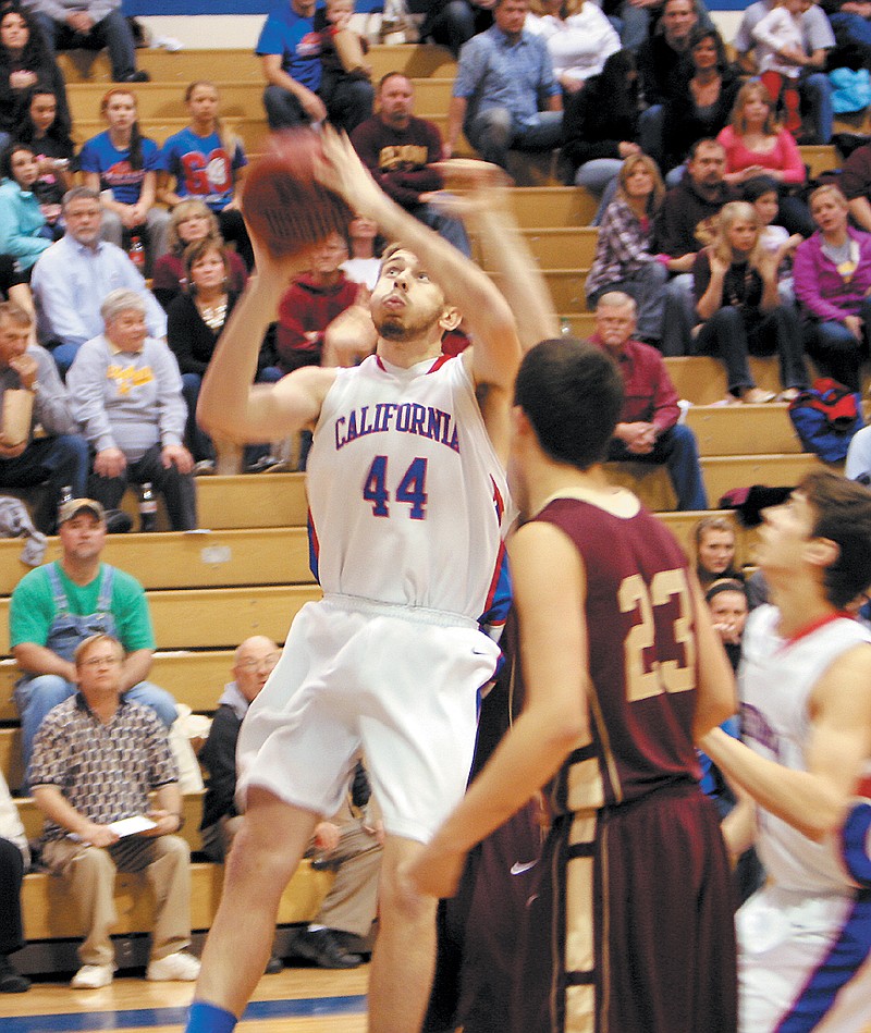 Curtis Lehman (44) puts up a shot during the varsity game against Eldon Friday night at California's Courtwarming. The Pintos defeated the Mustangs 54-44.