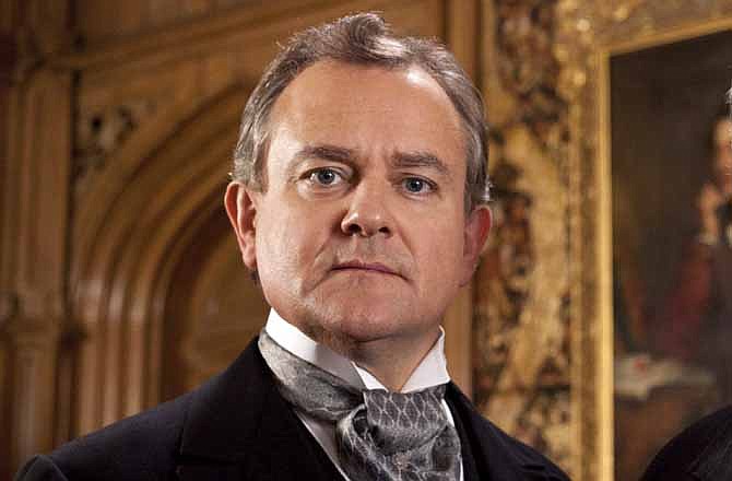 This publicity image released by PBS shows Hugh Bonneville in a scene from the popular series "Downton Abbey." Bonneville portrays the patriarchal Lord Grantham in the series, "Downton Abbey." The season three finale airs Sunday, Feb., 17 on PBS. 