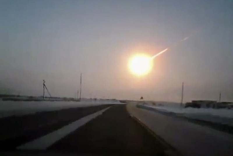 In this frame grab made from a video from a dashboard camera on Friday, a meteorite contrail is seen. A meteor streaked across the sky of Russia's Ural Mountains on Friday morning, causing sharp explosions and reportedly injuring around 1,000 people, including many hurt by broken glass. 