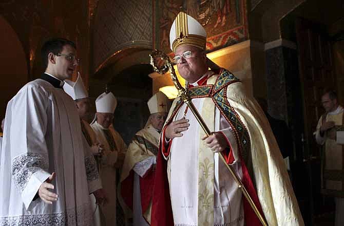 In this photo taken on Saturday, Jan. 26, 2013, Cardinal Timothy Dolan, archbishop of New York, takes part in the recessional for Stan Musial during his funeral at the Cathedral Basilica in St. Louis. Prevailing modern wisdom has been that an American - or a citizen of any superpower - could not be elected pope. Many Vatican watchers still think that's true, but others say that Dolan, a Ballwin native, may represent the first real prospect of an American pontificate. (Post-Dispatch/AP)